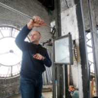 Tom Smith shows how to reset the clocks in the tower of the Great Northern Bicycle Company building in downtown Fargo, N.D. Carrie Snyder / The Forum