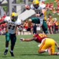 North Dakota State University’s Carson Wentz (11) jumps over Jevohn Miller (55) for yardage against Iowa State on Saturday, August 30, 2014 in Ames, Iowa. Carrie Snyder / The Forum