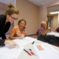 North Dakotans against Measure 1 Field Manager, Molly McLain, left, trains in Cindy Roholt, a volunteer, on Tuesday, August 19, 2014. The training helps volunteers learn how to properly communicate with voters about the measure. Carrie Snyder / The Forum